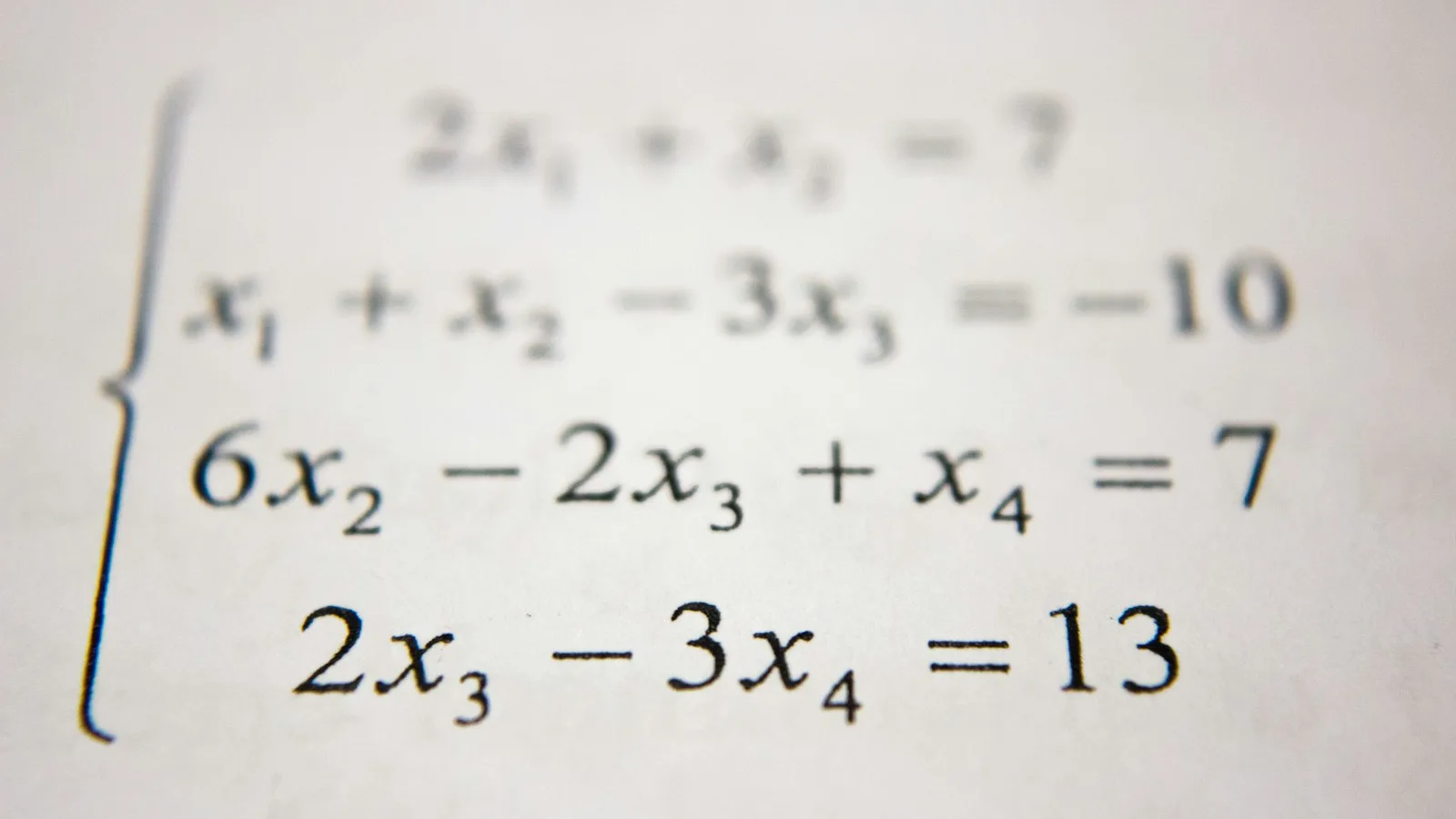 Student solving advanced mathematics equations on a classroom board